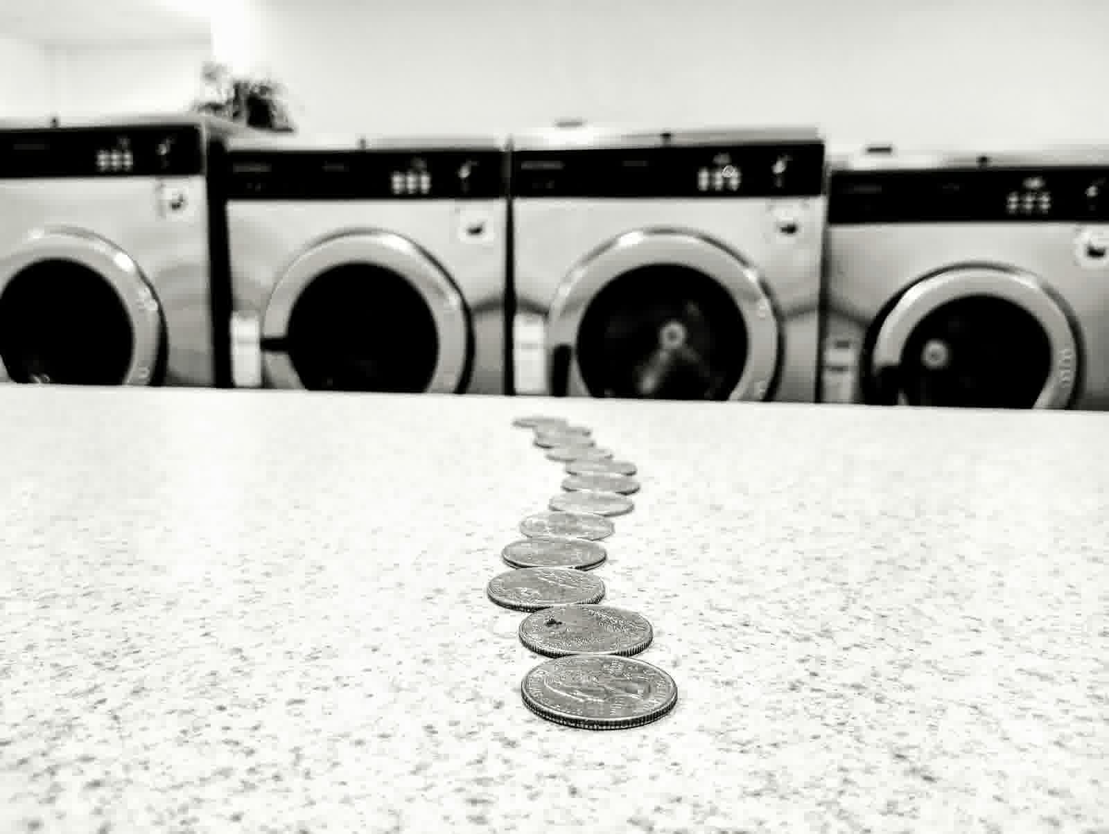 Quarters on a laundromat folding table